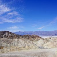 View of mountains and a dry lake bed in the background